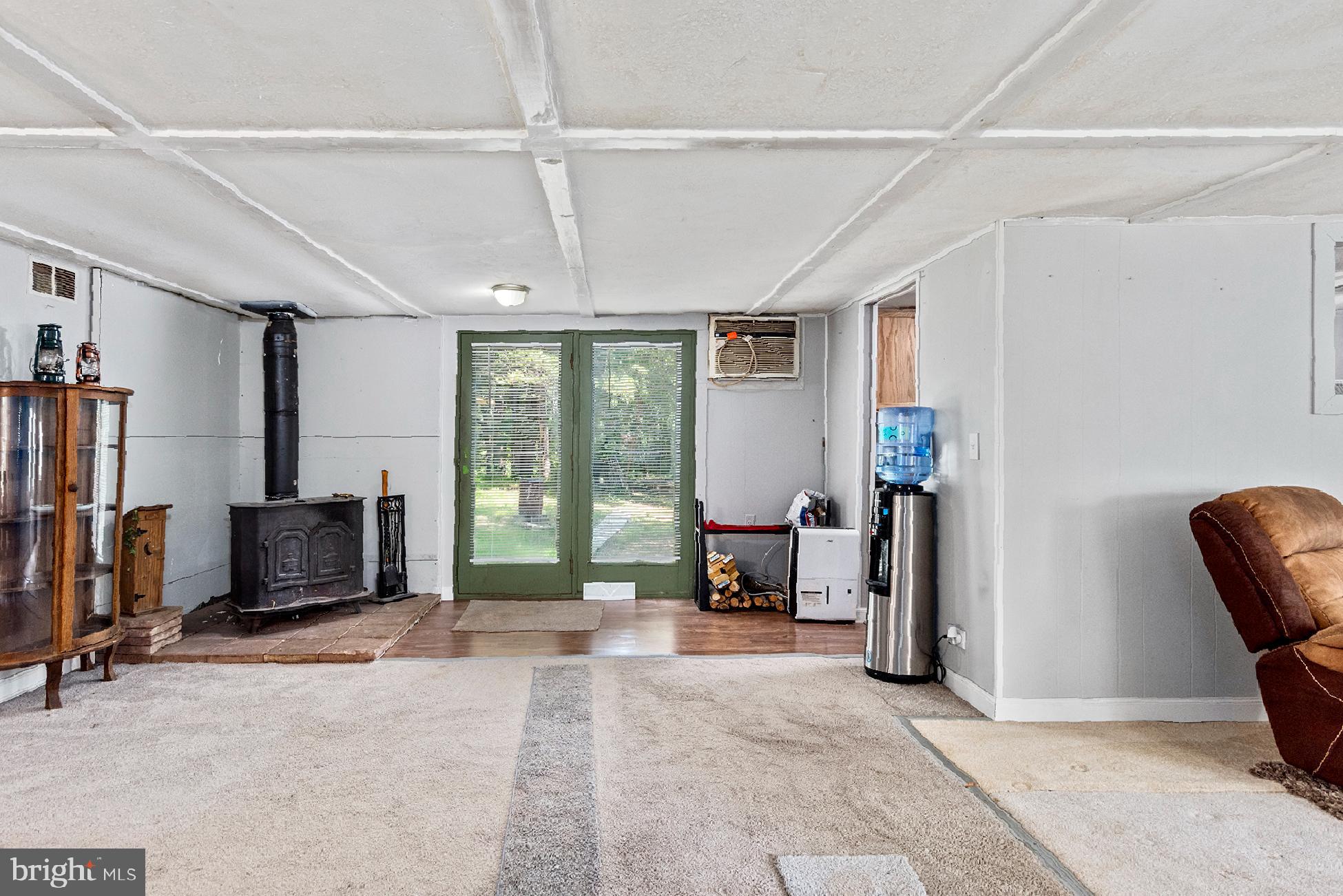 11335 Needam Road Worton, MD 21678 - Photo 8 of 22 Wood stove and backdoor