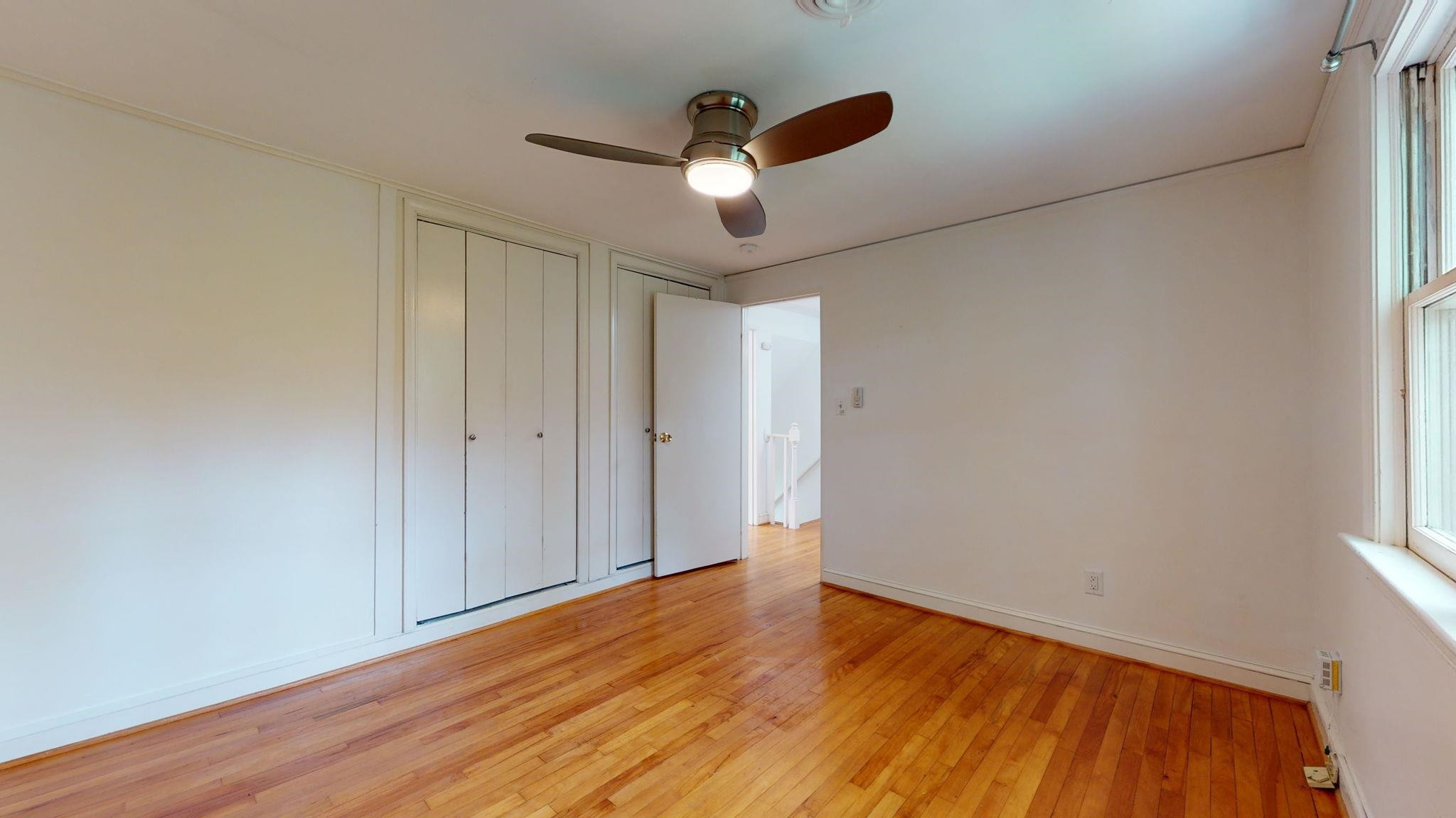 845 Bryan Street Raleigh, NC 27605 - Photo 23 of 31 Bedroom 2 with remote controlled ceiling fan.