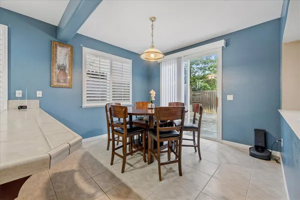 a view of a dining room with furniture window and outside view