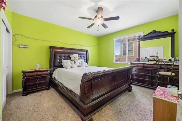 a bed room with a bed and a chandelier