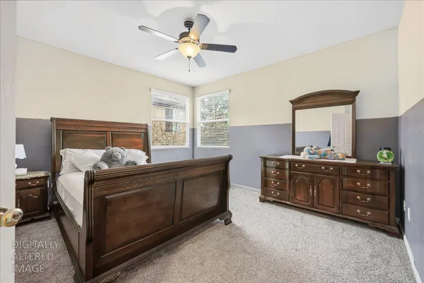 a bedroom with a bed and a dresser