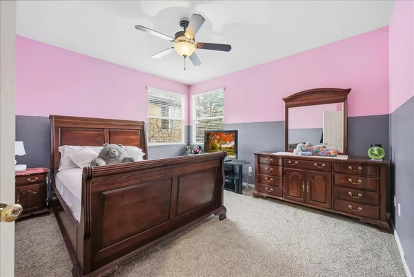 a bed room with a bed and a dresser