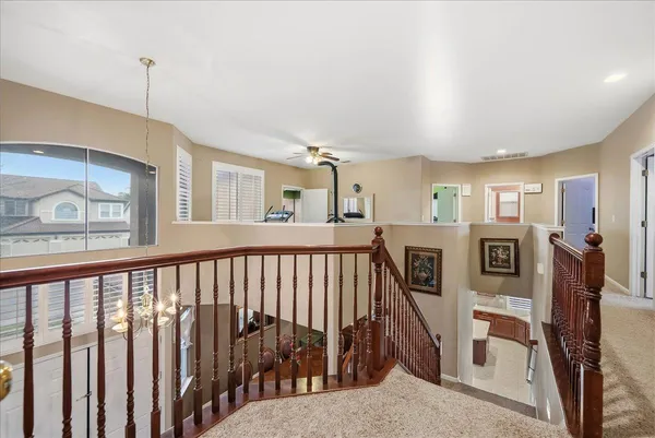 a view of a hallway with windows