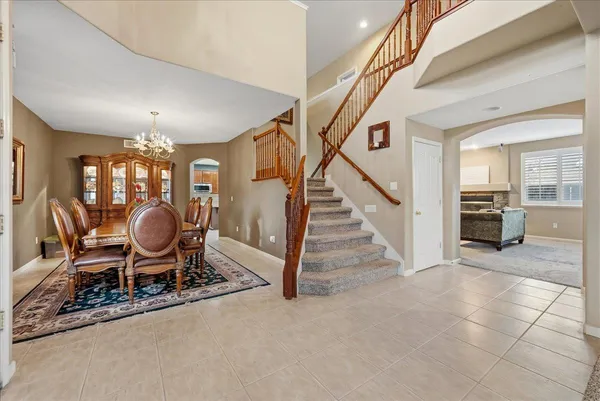 an entryway and livingroom with furniture