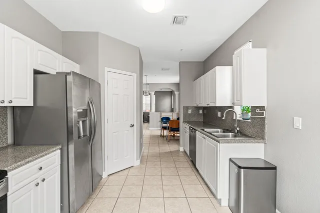 a dining room with furniture a rug and wooden floor