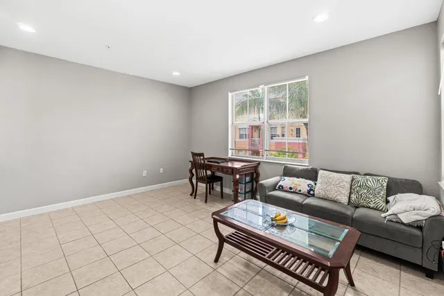 a bathroom with a granite countertop sink toilet and a mirror