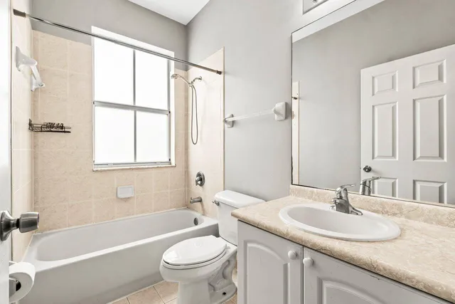 a workspace with wooden floor and a window