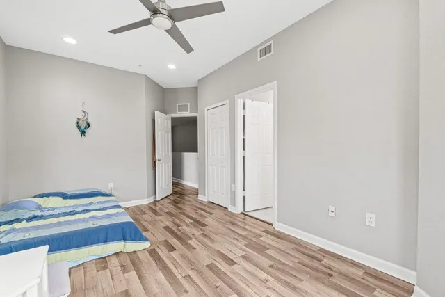 a view of hallway with wooden floor