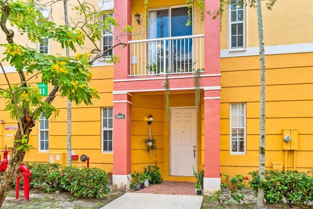 a kitchen with a sink a counter top space cabinets and stainless steel appliances