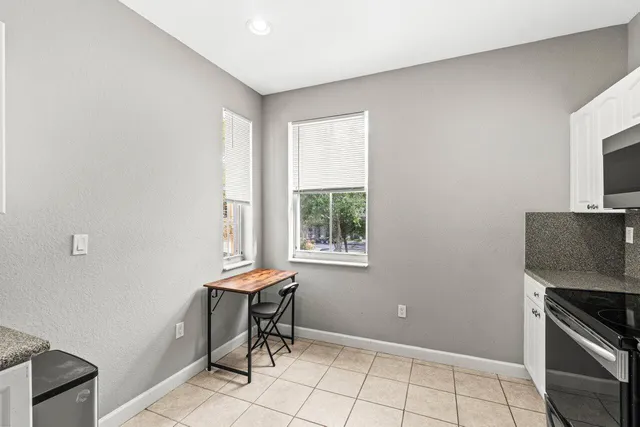 a kitchen with stainless steel appliances a refrigerator stove and sink