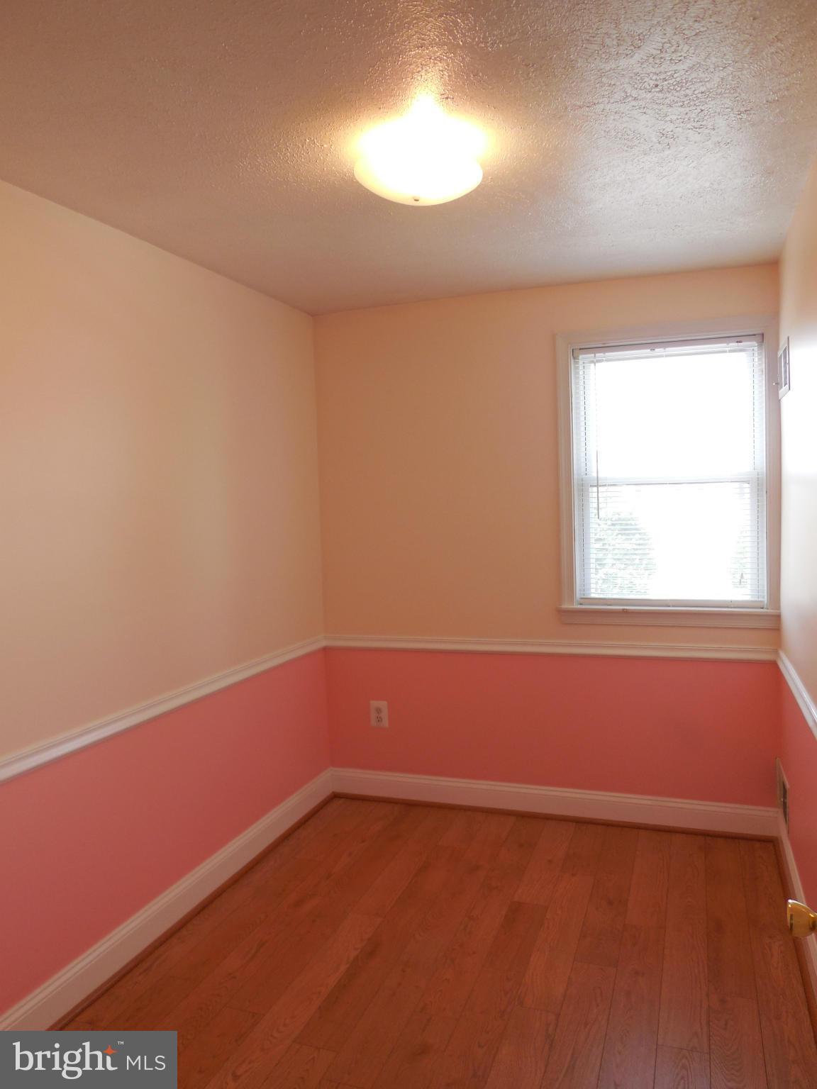 446 Grovethorn Road Baltimore, MD 21220 - Photo 11 of 25 an empty room with a window