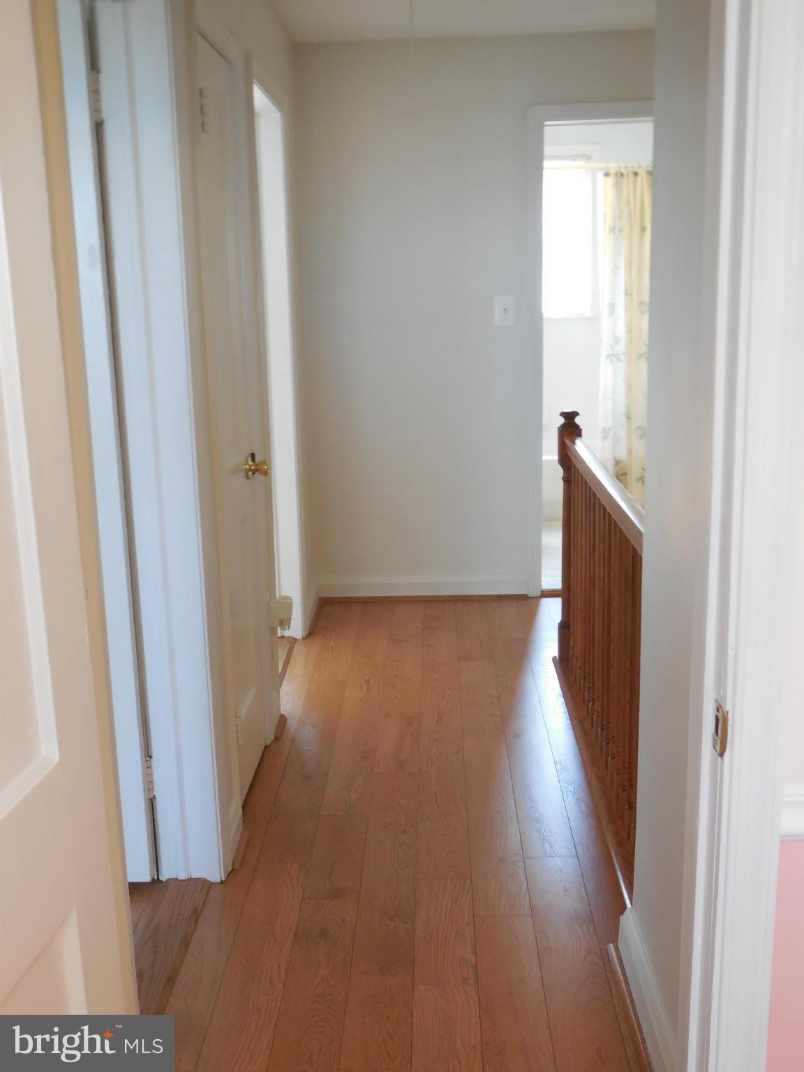 446 Grovethorn Road Baltimore, MD 21220 - Photo 14 of 25 a view of a hallway with wooden floor