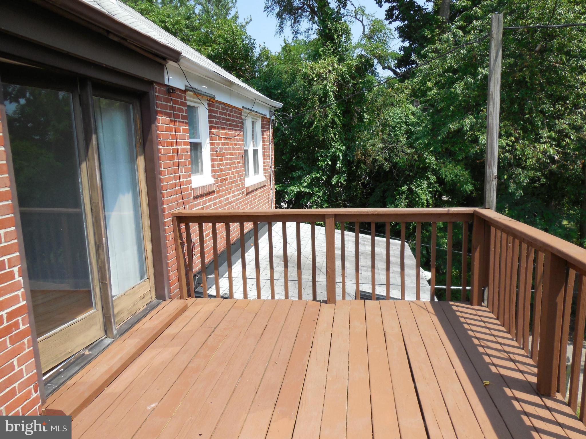 446 Grovethorn Road Baltimore, MD 21220 - Photo 20 of 25 a view of backyard with deck and wooden floor