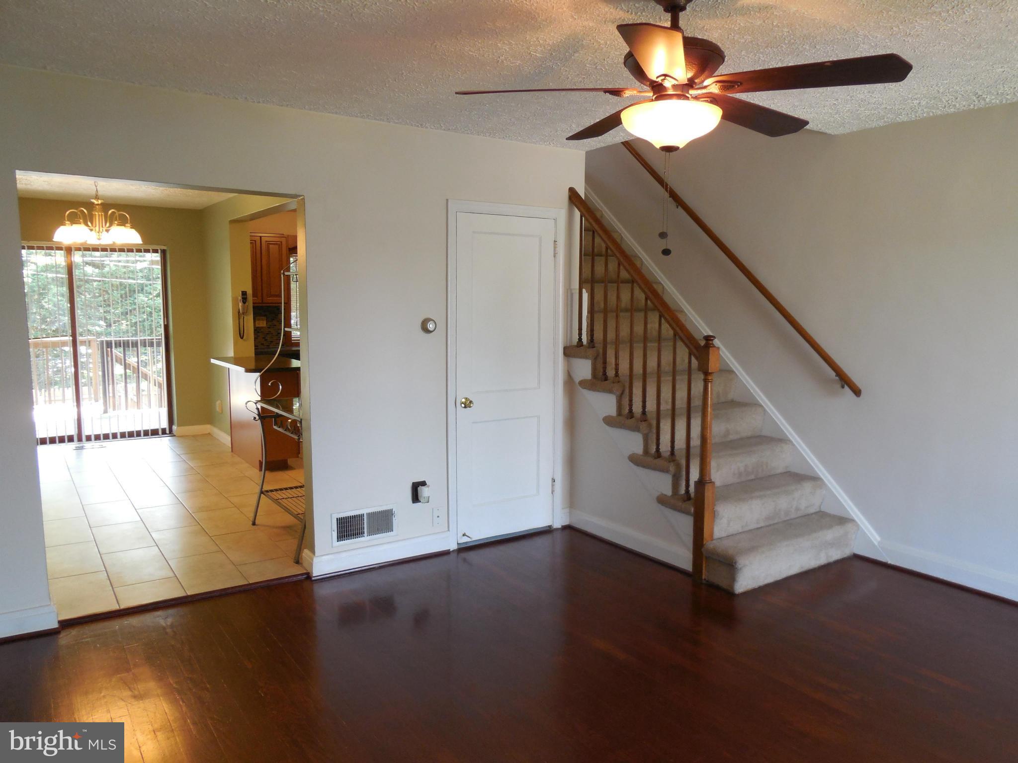 446 Grovethorn Road Baltimore, MD 21220 - Photo 3 of 25 a view of empty room with wooden floor and fan