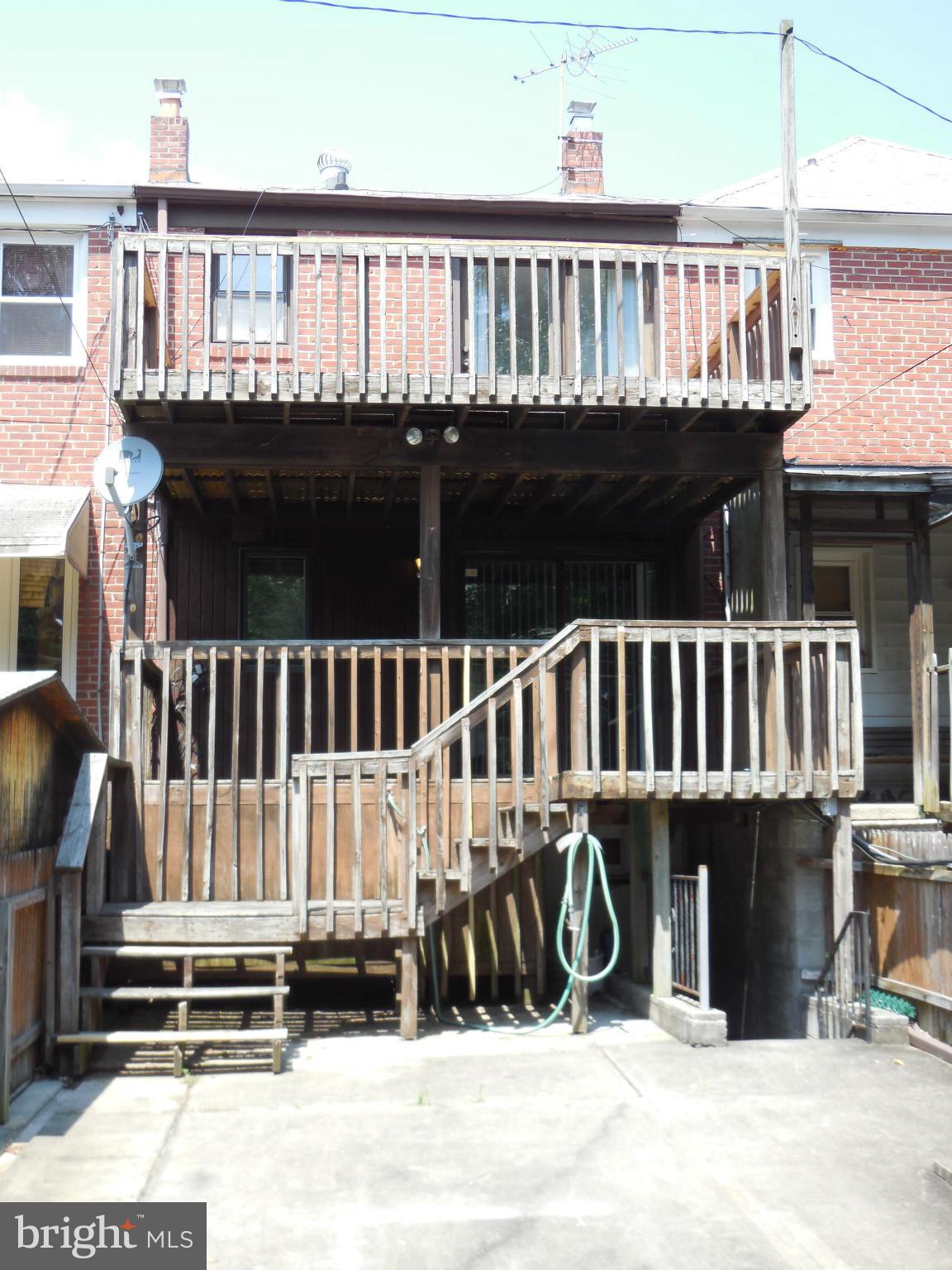 446 Grovethorn Road Baltimore, MD 21220 - Photo 21 of 25 a view of a house with wooden deck