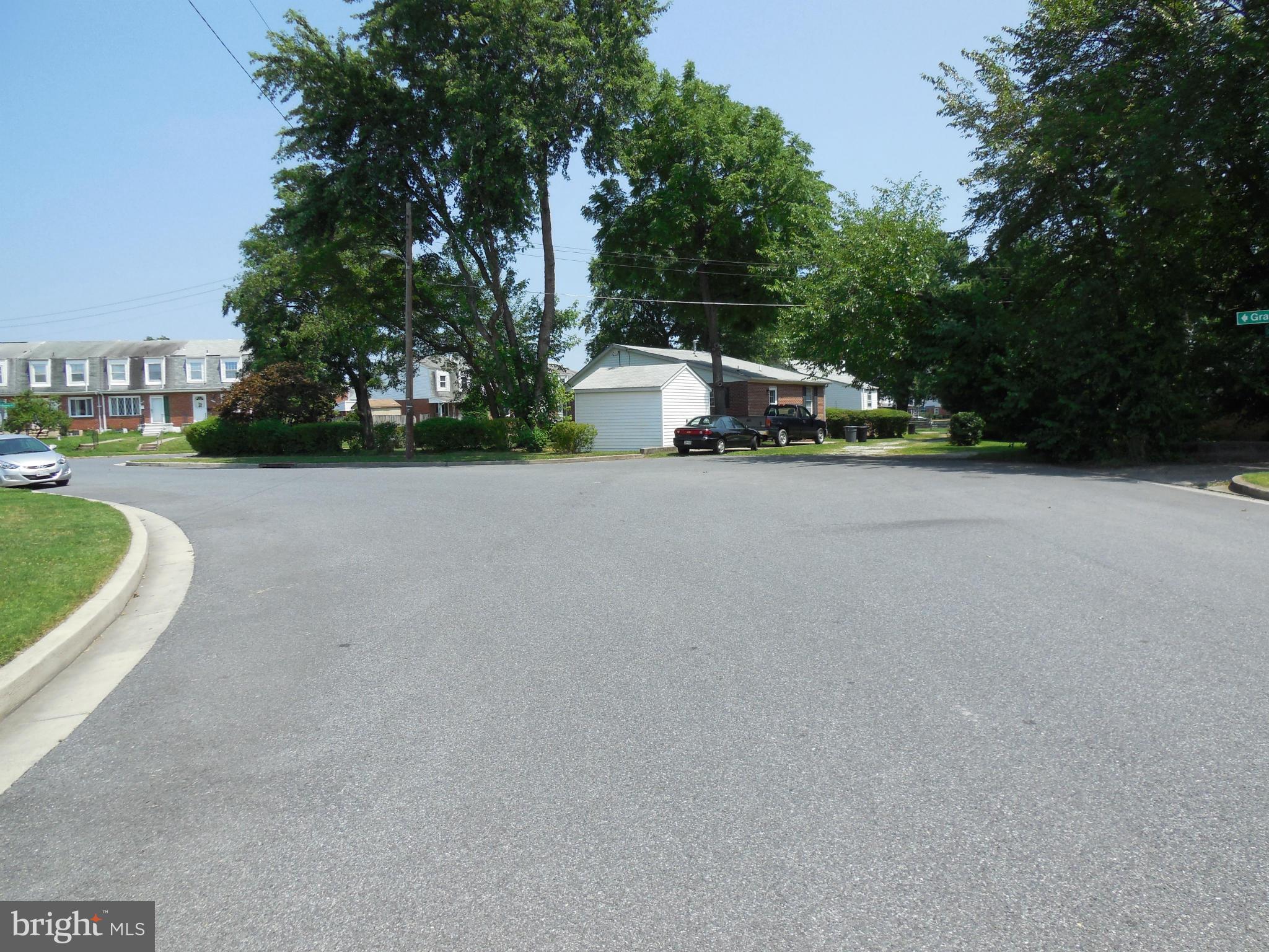 446 Grovethorn Road Baltimore, MD 21220 - Photo 25 of 25 a view of a house with a yard and large trees