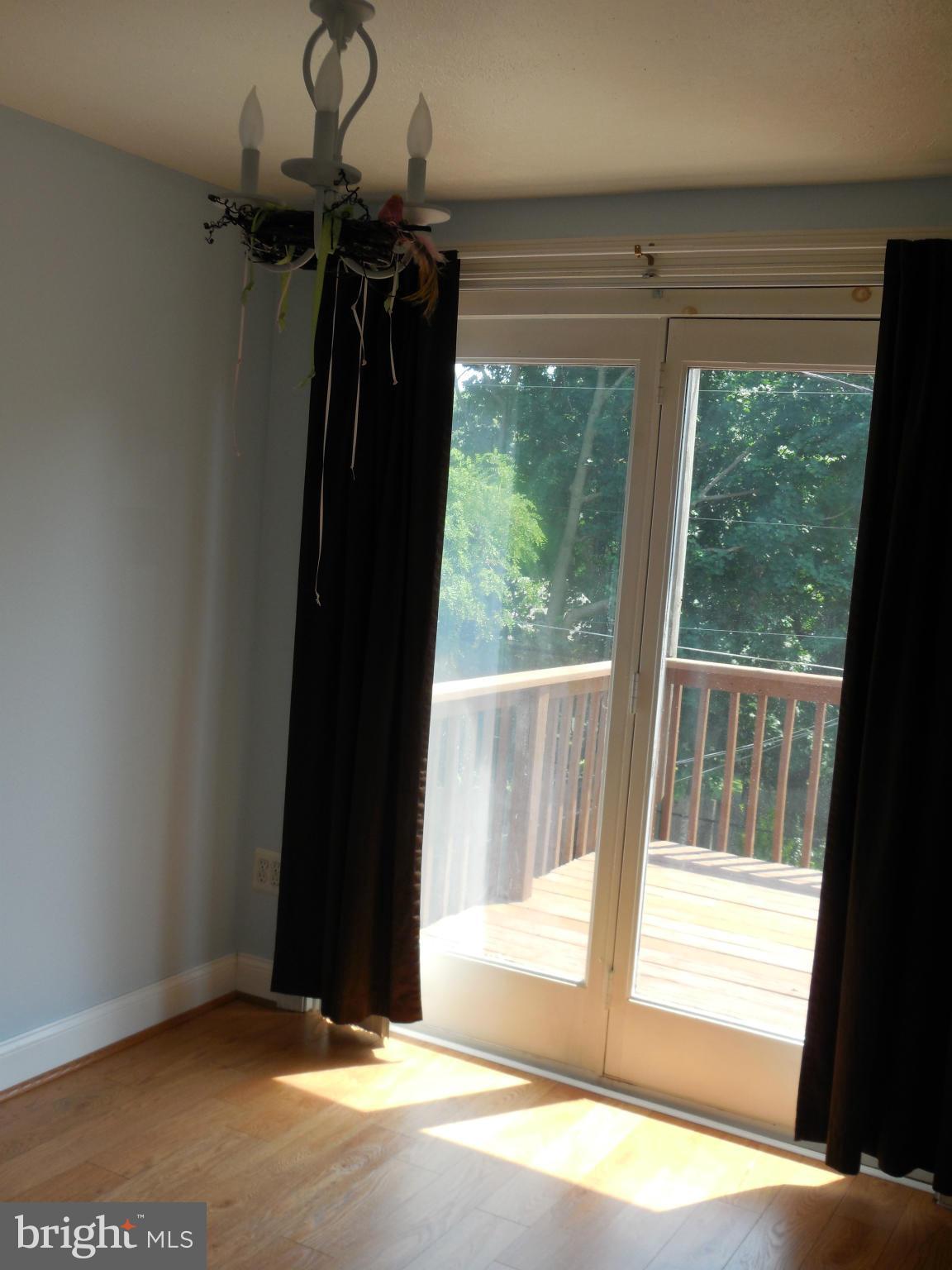 446 Grovethorn Road Baltimore, MD 21220 - Photo 9 of 25 a view of a room with a sliding door