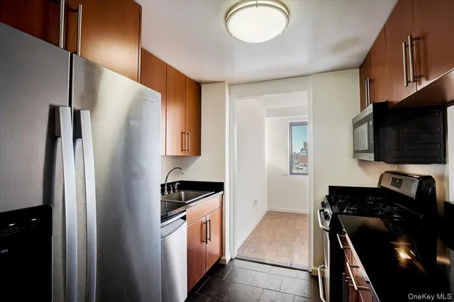 a kitchen with a refrigerator stove and a sink