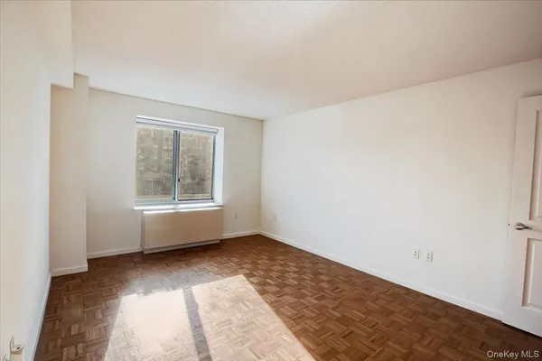 a view of an empty room with a window