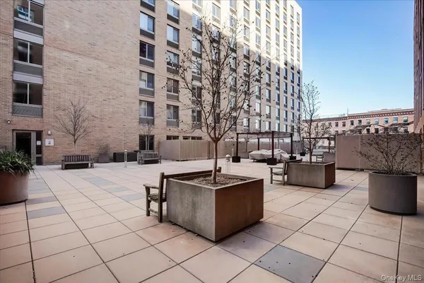 a view of a building with sitting area
