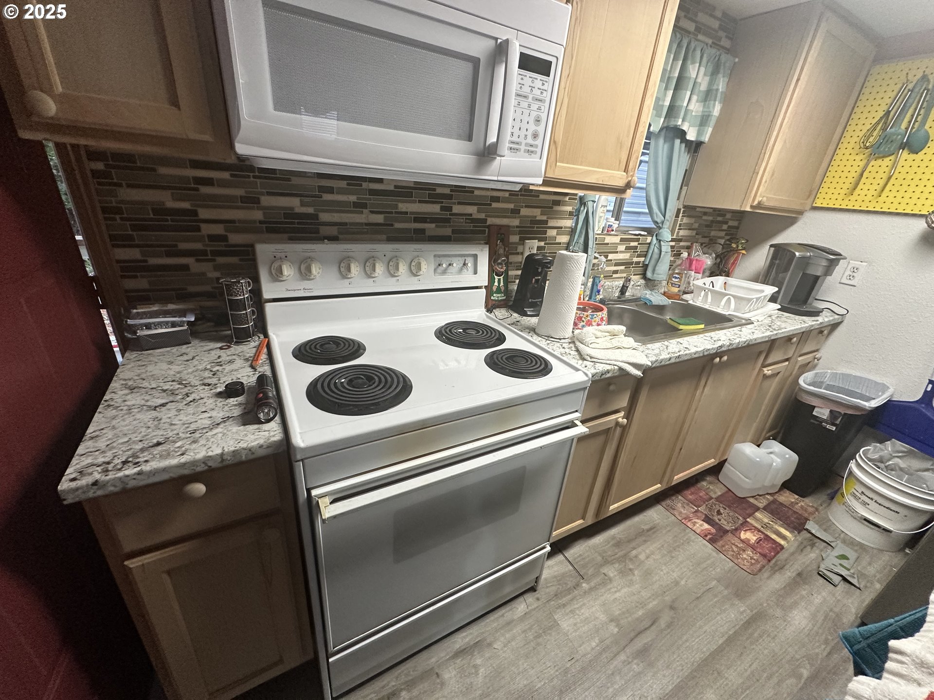 125 North 4th Street Lakeside, OR 97449 - Photo 13 of 39 a stove top oven sitting inside of a kitchen