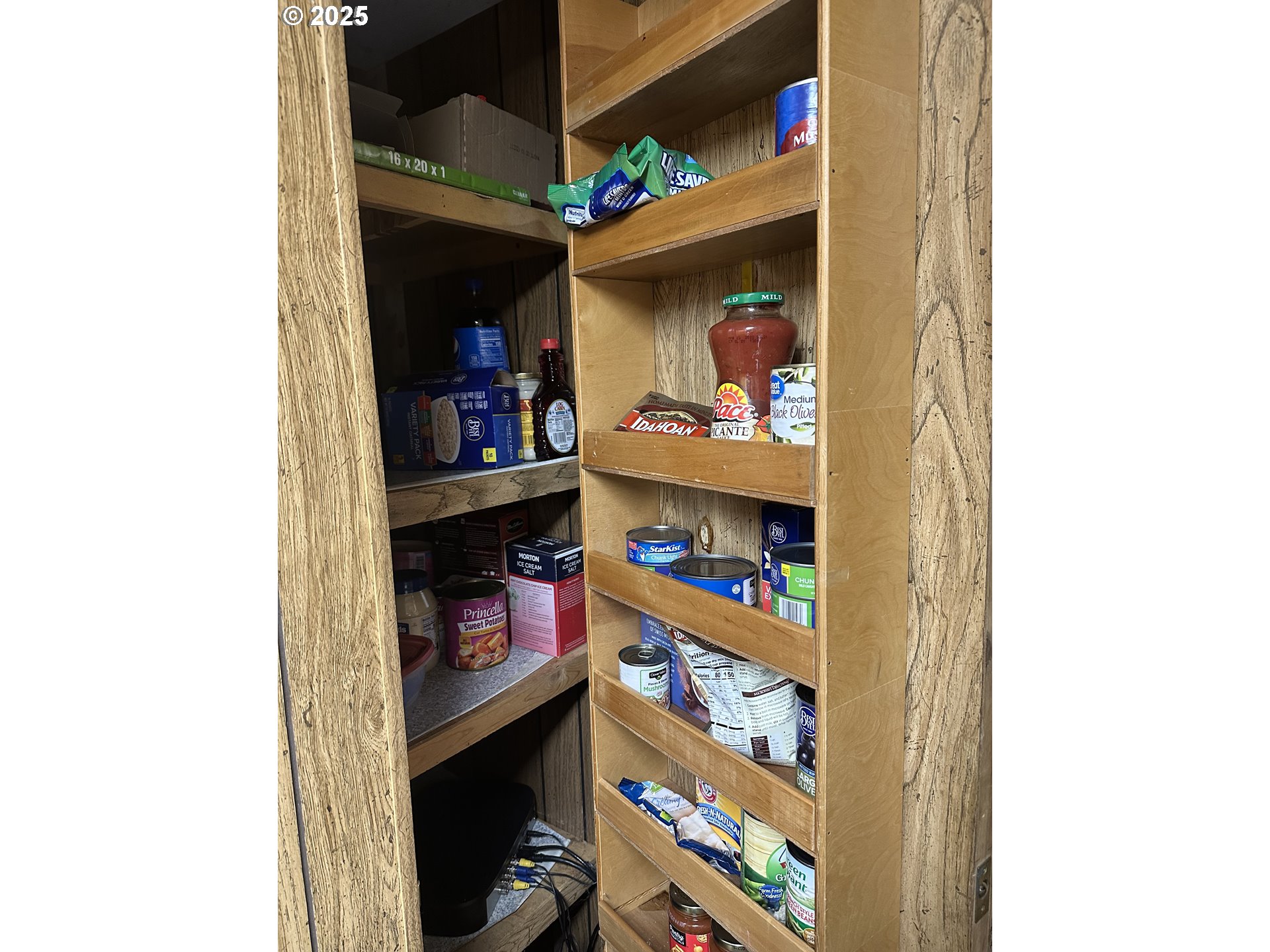 125 North 4th Street Lakeside, OR 97449 - Photo 14 of 39 a room with storage and a painting on the wall