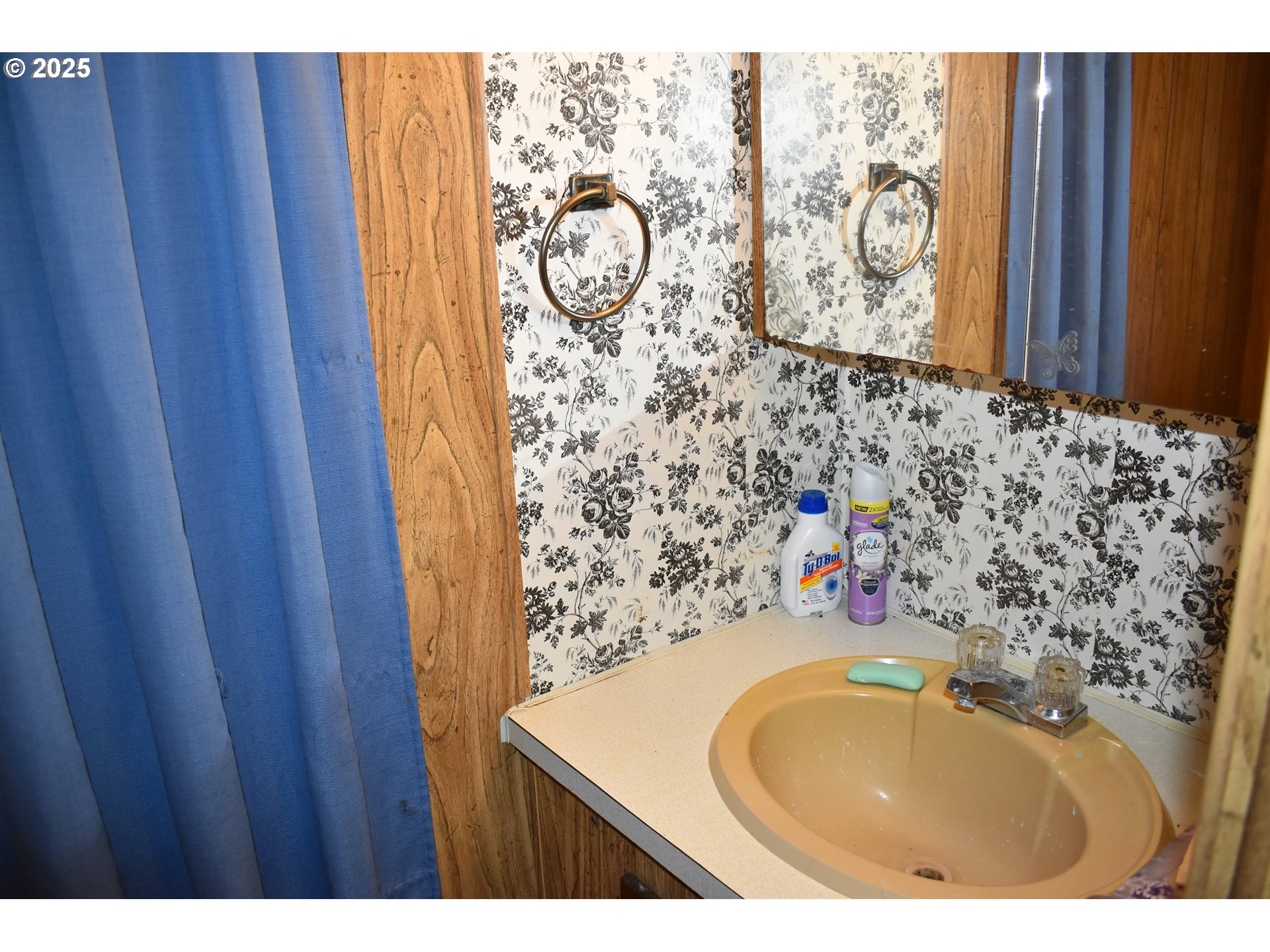 125 North 4th Street Lakeside, OR 97449 - Photo 22 of 39 a bathroom with a sink and a mirror