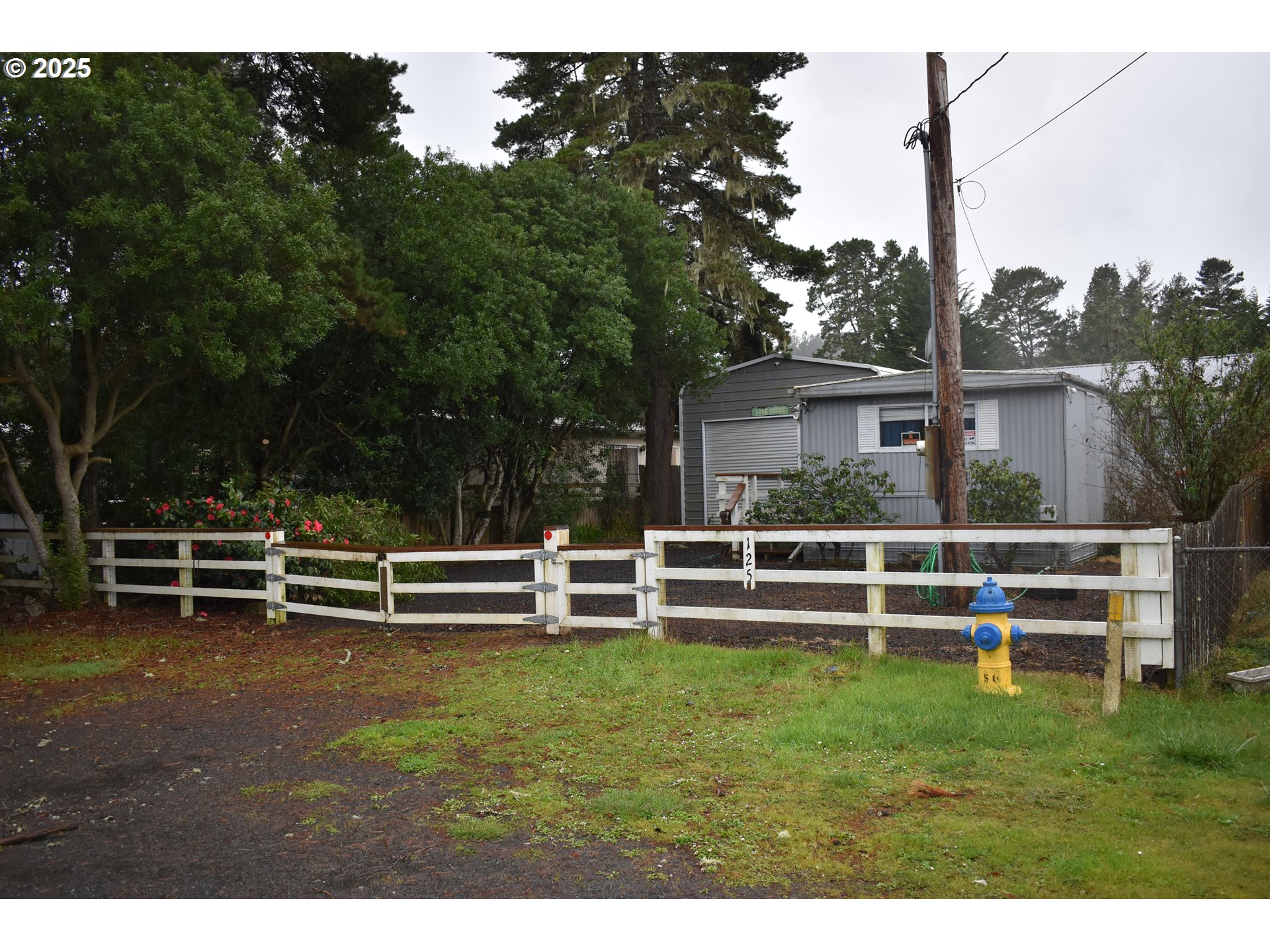 125 North 4th Street Lakeside, OR 97449 - Photo 3 of 39 a view of a house with a yard