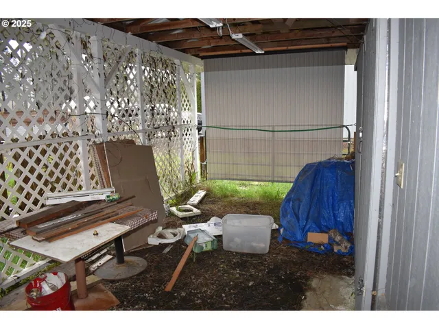 a view of a house with a yard and sitting area