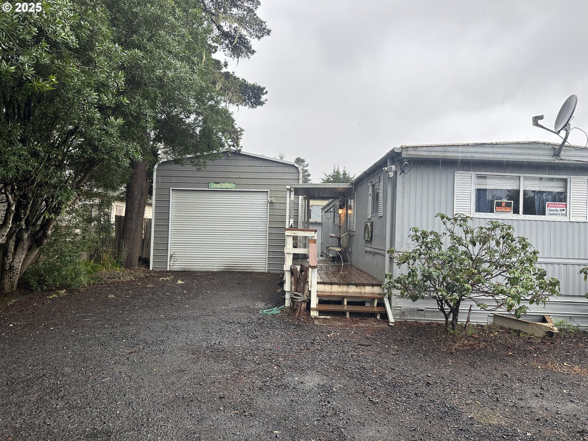 125 North 4th Street Lakeside, OR 97449 - Photo 35 of 39 a view of a house with a yard and sitting area
