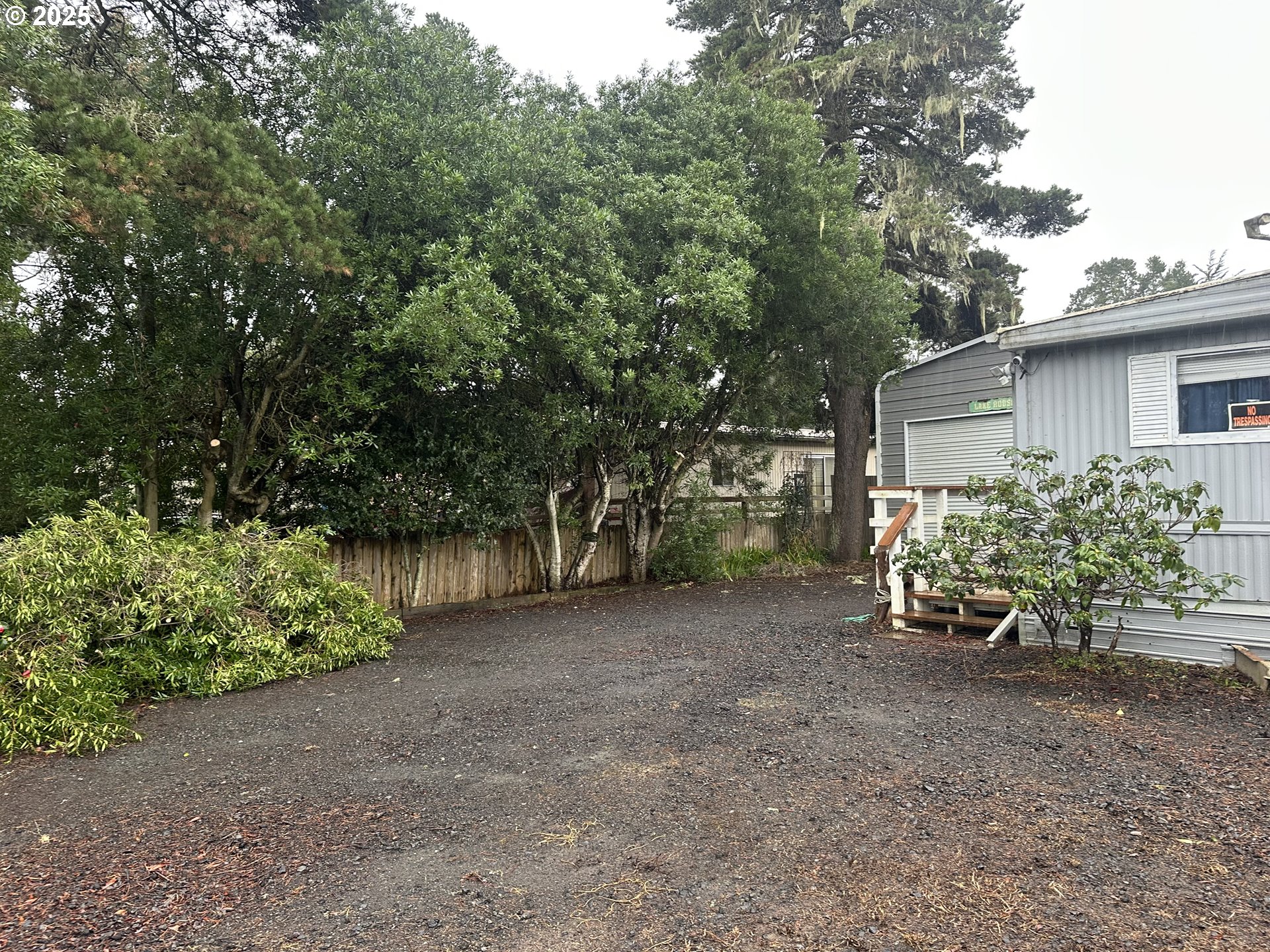 125 North 4th Street Lakeside, OR 97449 - Photo 37 of 39 a view of a house with large trees