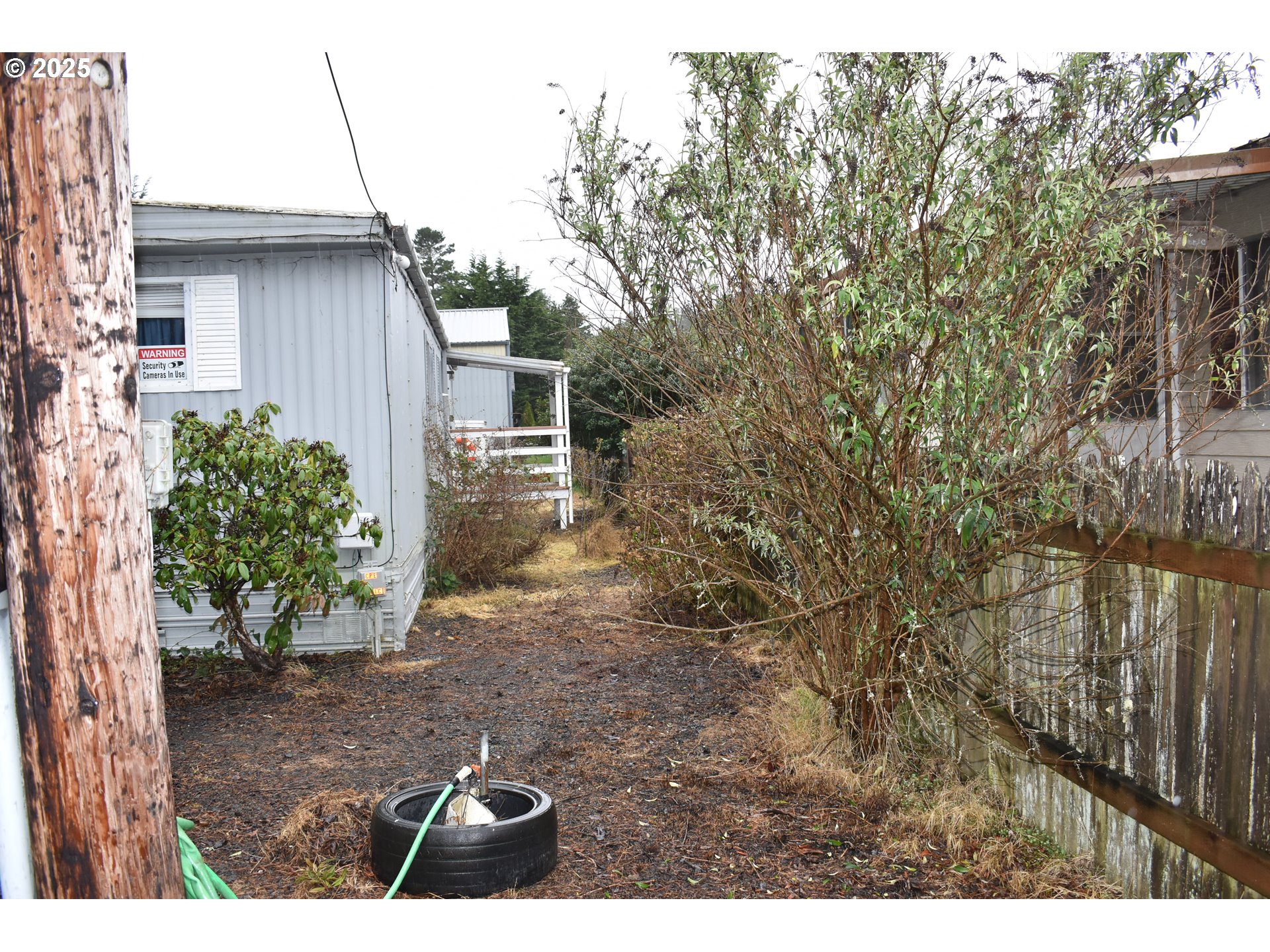 125 North 4th Street Lakeside, OR 97449 - Photo 8 of 39 a backyard of a house with lots of green space