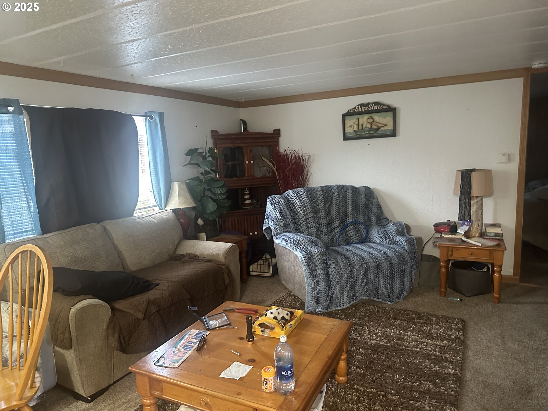 125 North 4th Street Lakeside, OR 97449 - Photo 10 of 39 a living room with furniture and a couch