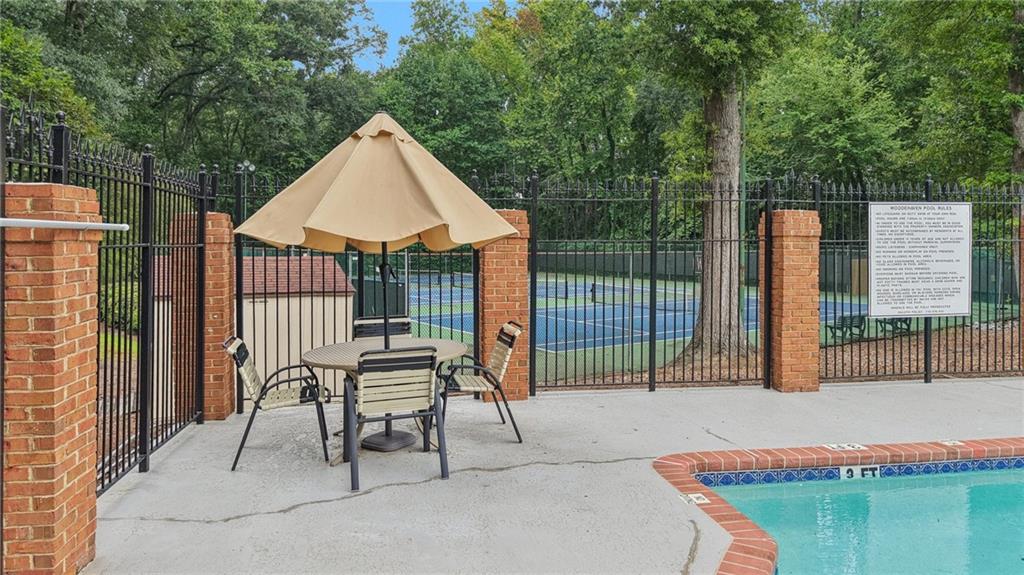 4166 Oakwood Way Duluth, GA 30096 - Photo 21 of 28 a house view with a sitting space and garden