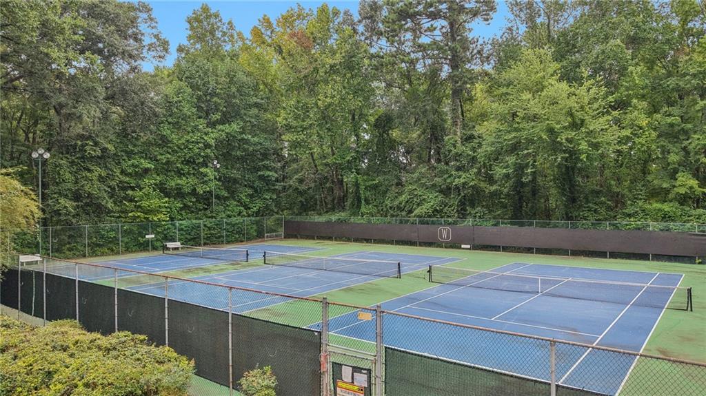 4166 Oakwood Way Duluth, GA 30096 - Photo 27 of 28 a view of an outdoor space and tennis court