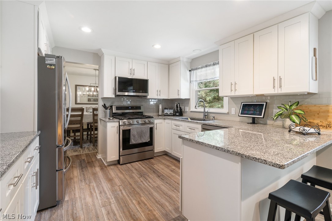 1827 Spring Valley Avenue Northwest Canton, OH 44708 - Photo 11 of 32 remodeled kitchen with an air fryer stove & air fryer microwave