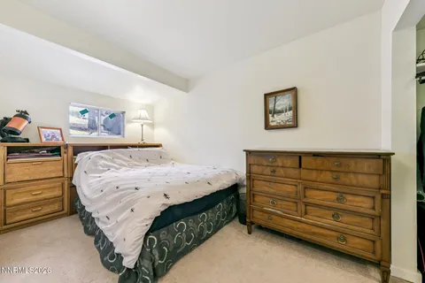 a bedroom with a bed and closet