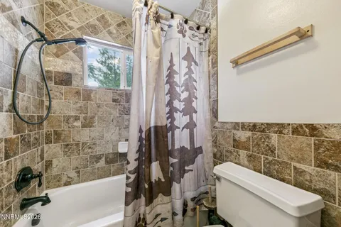 a view of wooden fence and trees