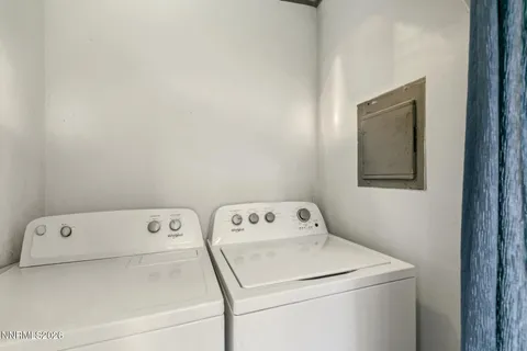 a view of a wooden house with a yard