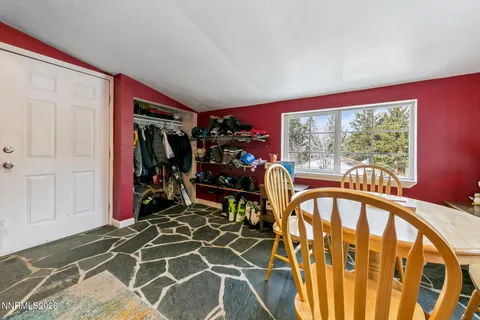 a view of a dining room with furniture window and outside view