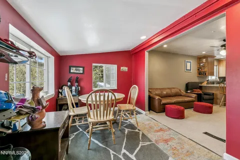 a view of a dining room with furniture window and outside view
