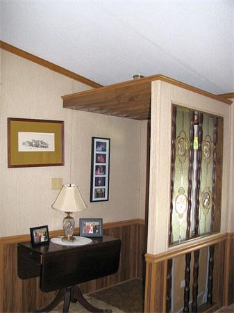 154 Great Road, Unit 4 Shirley, MA 01464 - Photo 4 of 16 a living room with furniture and paintings on the wall