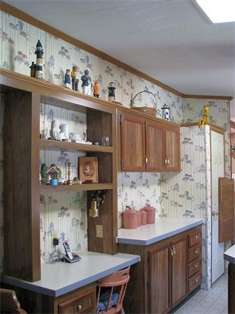 154 Great Road, Unit 4 Shirley, MA 01464 - Photo 8 of 16 a kitchen with stainless steel appliances a sink a stove and cabinets