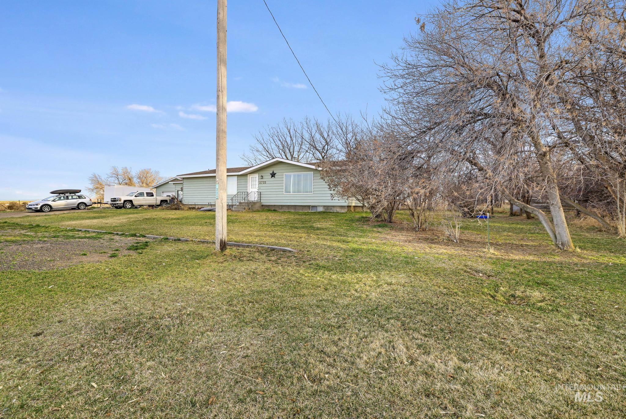 2735 East 3300 N Road Twin Falls, ID 83301 - Photo 2 of 24 View of grassy yard