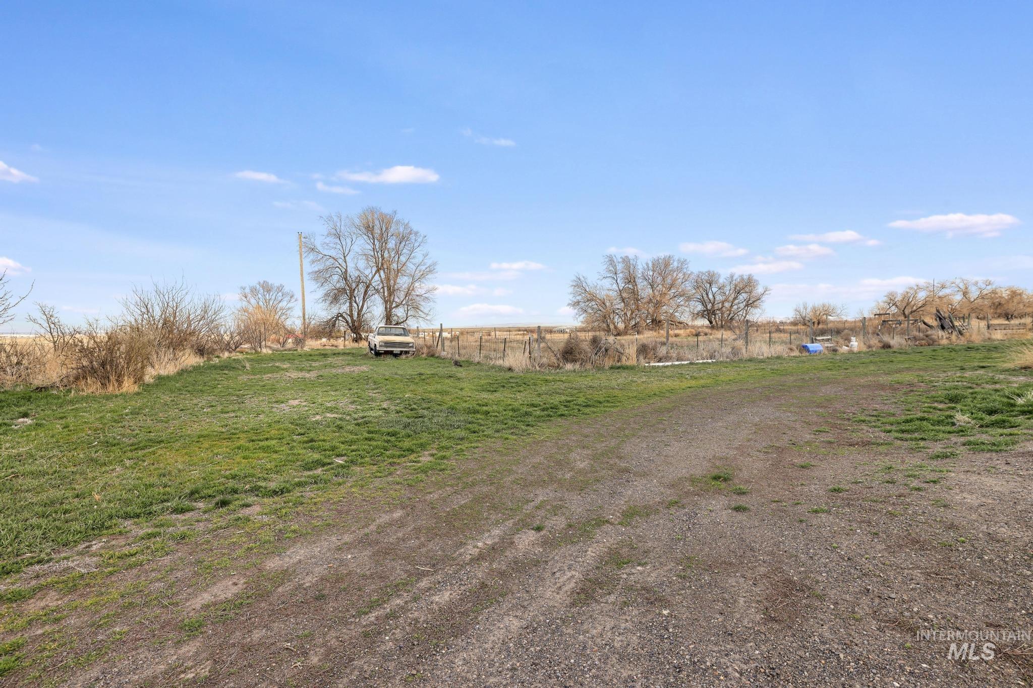 2735 East 3300 N Road Twin Falls, ID 83301 - Photo 9 of 24 View of yard with a view of countryside