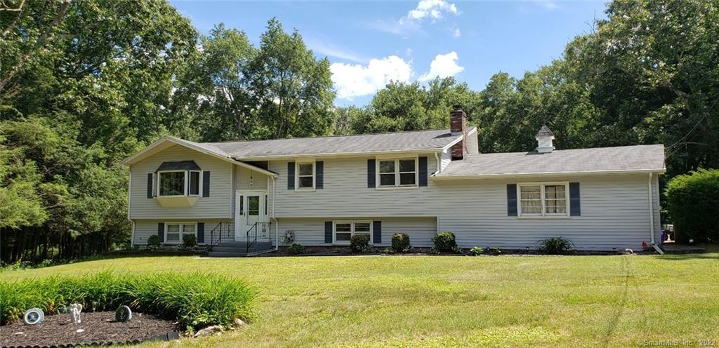 11 Doolittle Road Preston, CT 06365 - Photo 1 of 1 a front view of a house with yard and trees