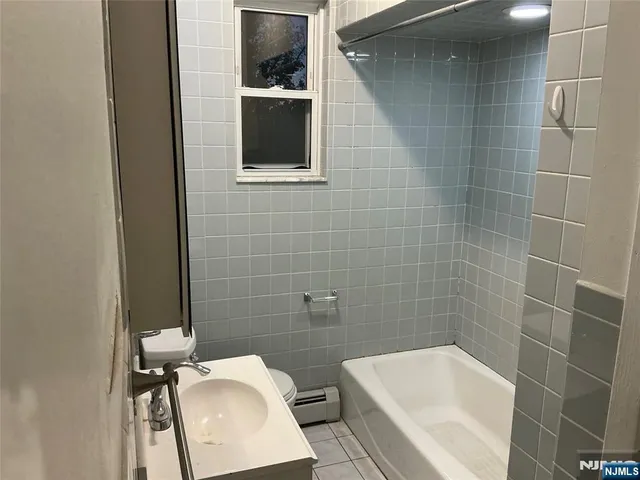 a bathroom with a toilet and sink