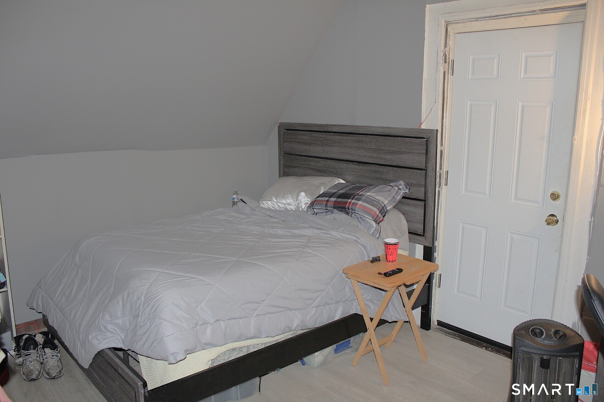90 Franklin Street Meriden, CT 06450 - Photo 23 of 40 a bedroom with a bed and a table in it