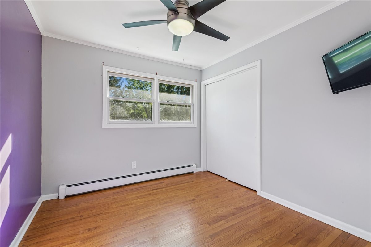 208 South River Road Fox River Grove, IL 60021 - Photo 12 of 40 a view of an empty room with window and wooden floor