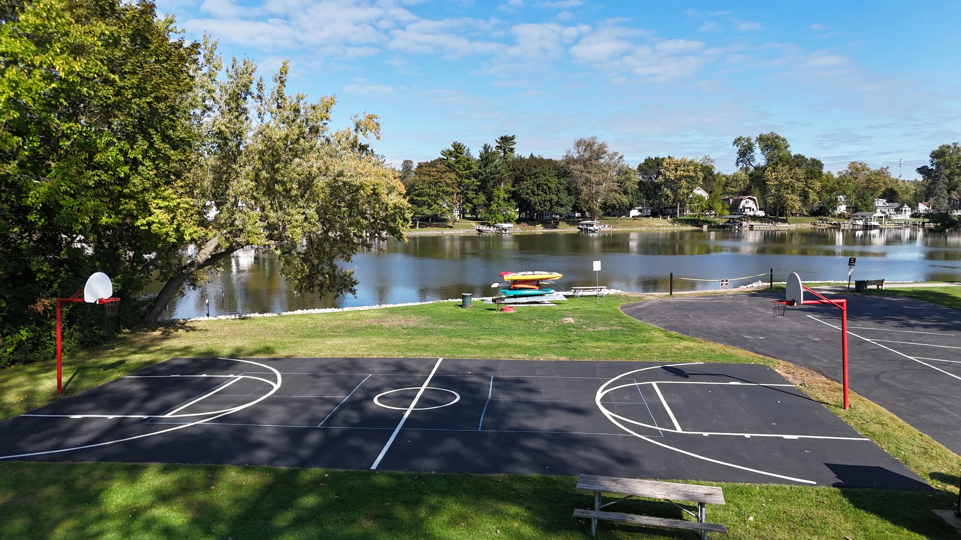 208 South River Road Fox River Grove, IL 60021 - Photo 37 of 40 a view of a swimming pool with a yard and a lake view